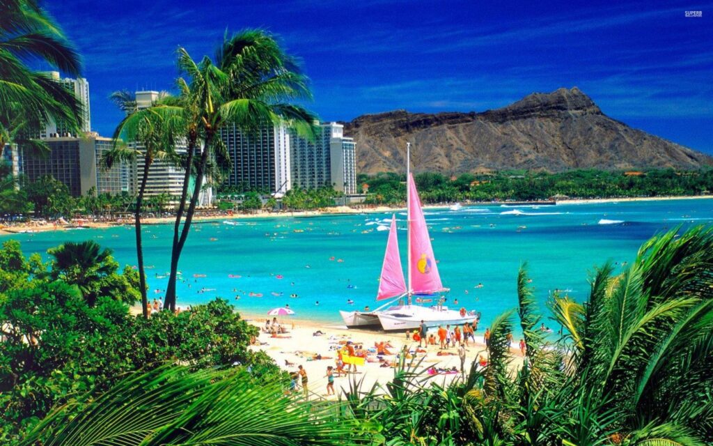 Waikiki Beach and Diamond Head with a catamaran offshore