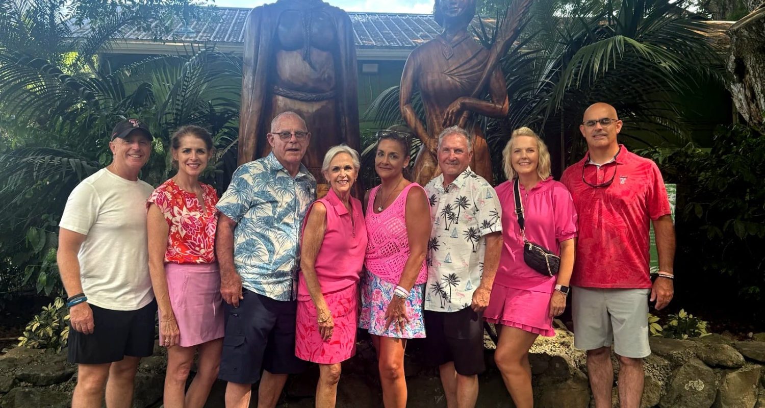 A group of guests posing together on an Oahu tour